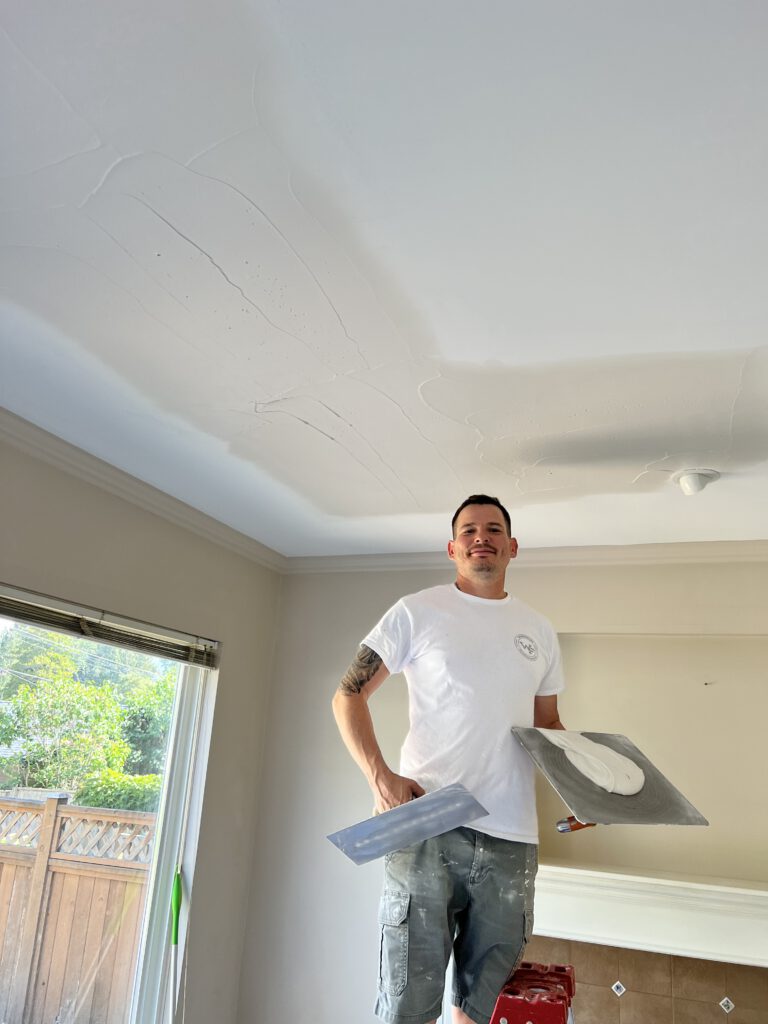 Skilled drywall finishing during a Poly-B repiping project—seamless results every time.